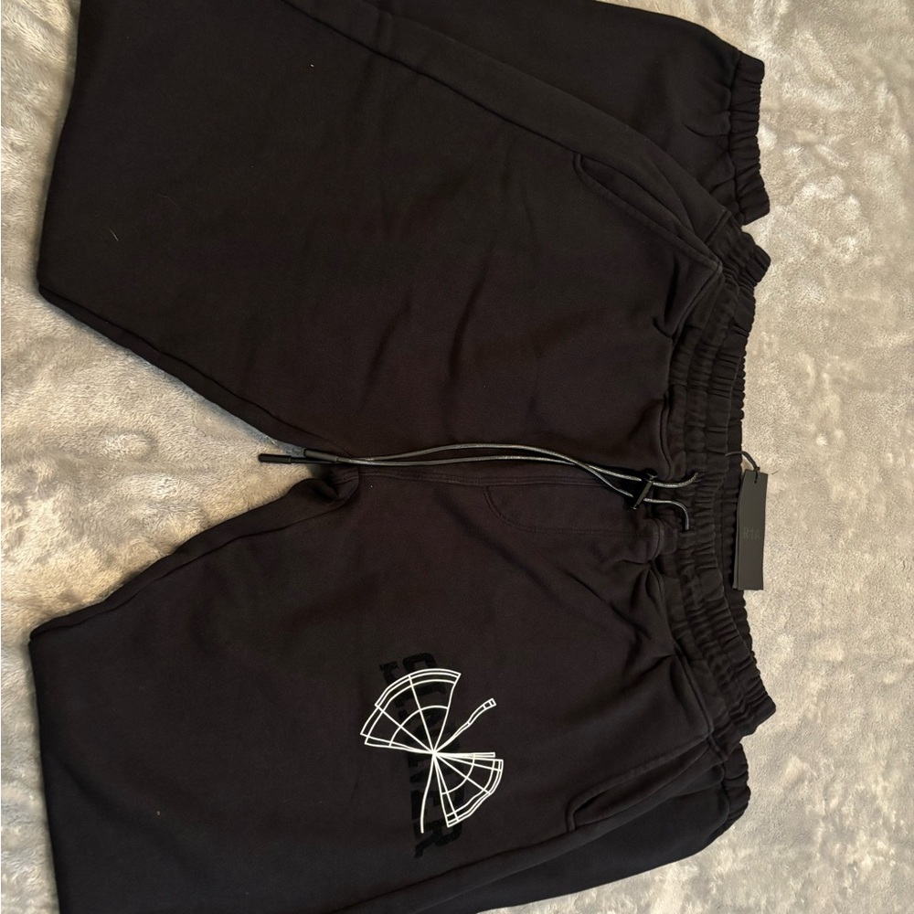 RTA Black Graphic Sweatpants with White  and black sinner Logo